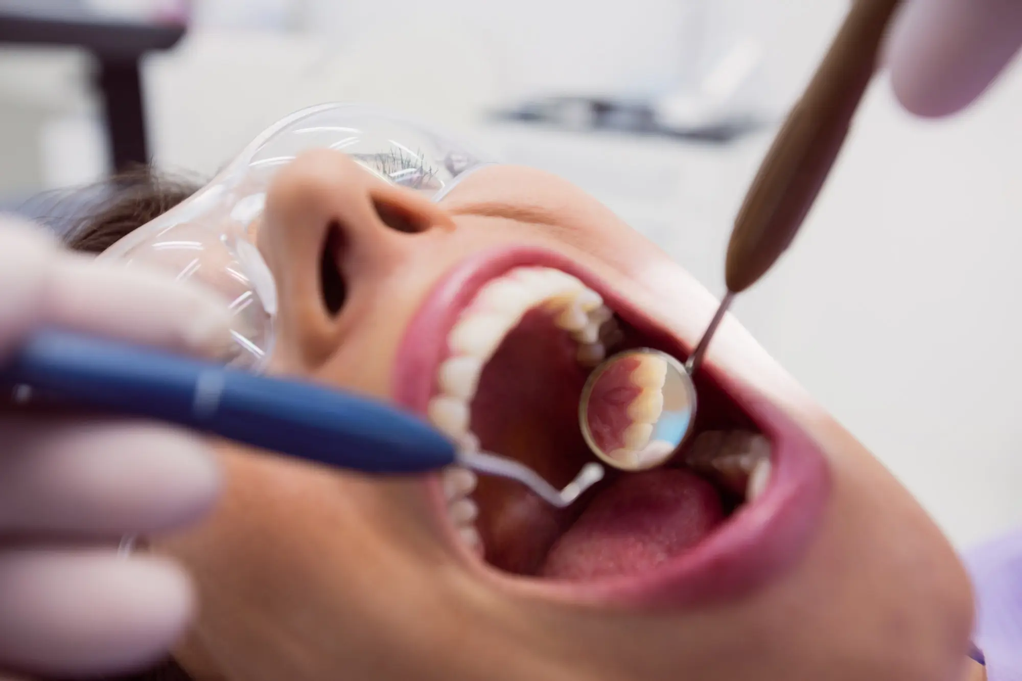 Patient sitting for an examination for dental fillings in Sugar Land